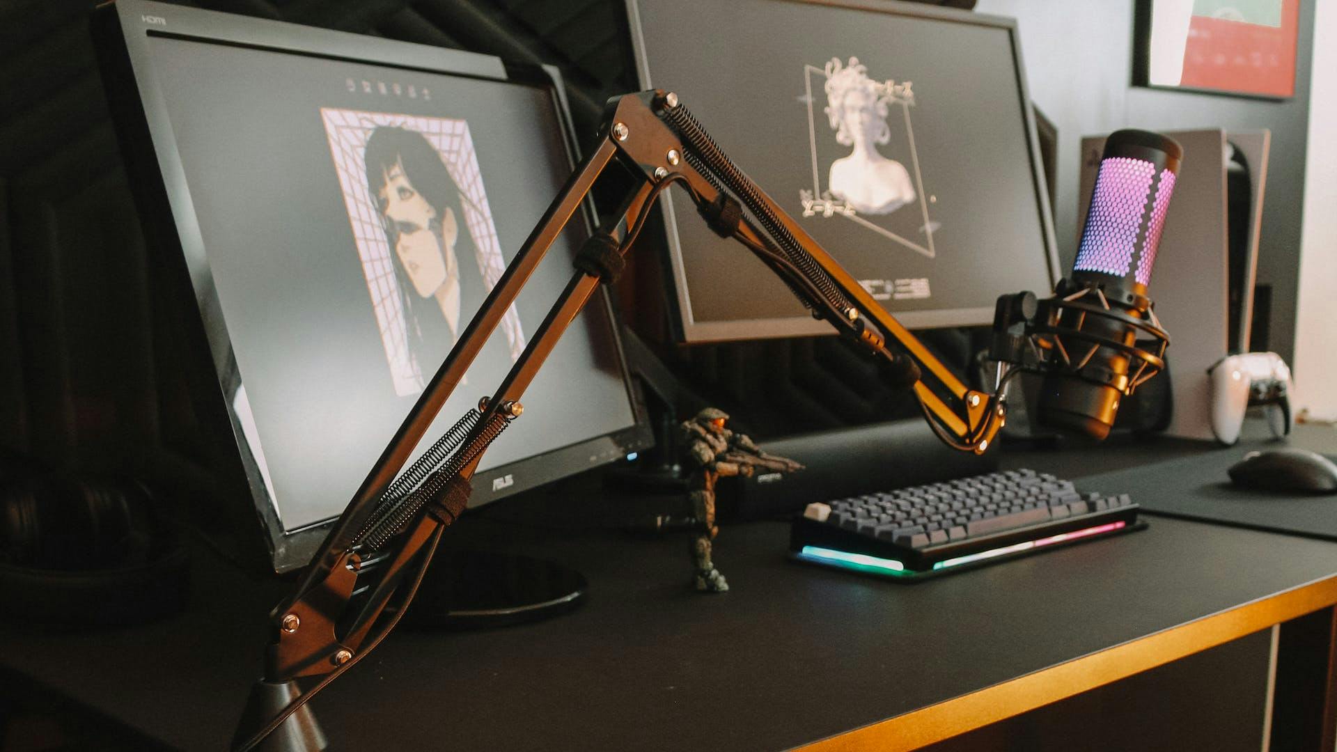 A professional mic mounted at a gaming desk setup