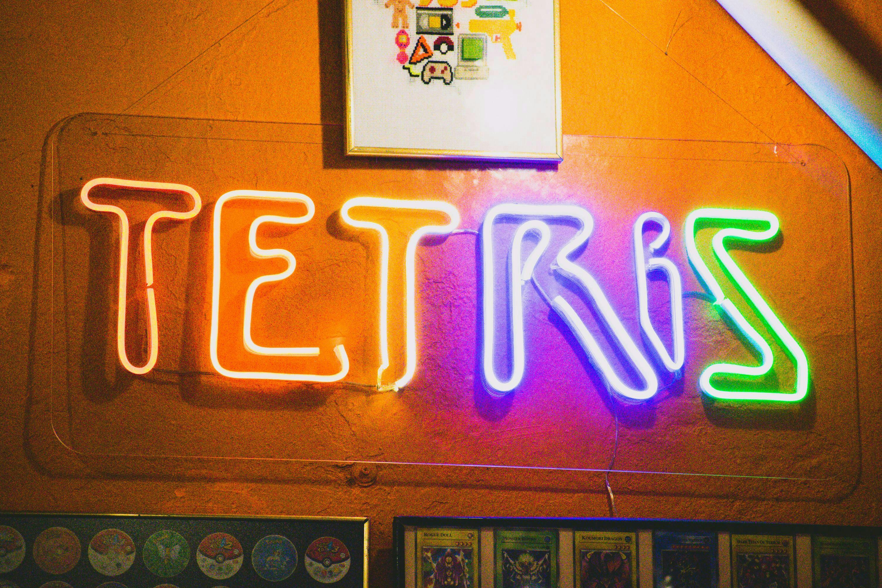 A decorative LED light as part of a gaming setup that illuminates the word "TETRIS" in different colors